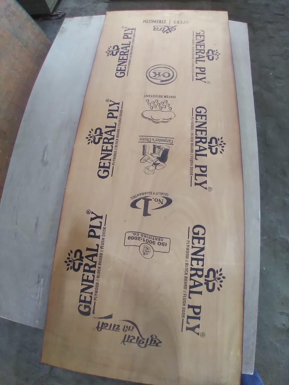 Client-supplied factory photograph of a sheet with General Ply branding